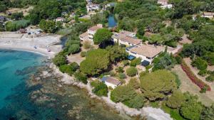 an aerial view of a house next to the ocean at Faounzina Village in Favone