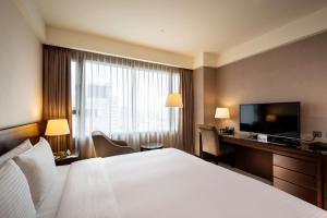 Postel nebo postele na pokoji v ubytování Lailai Hotel