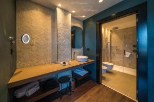 a bathroom with a sink and a shower at Catalonia Donosti in Donostia-San Sebastián