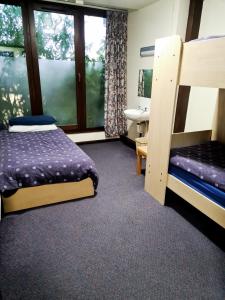 A bed or beds in a room at FSC Blencathra Hostel