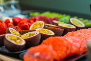 a platter of fruit on a plate at Catalonia Donosti in Donostia-San Sebastián