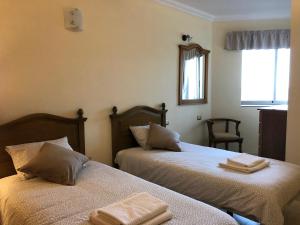 Łóżko lub łóżka w pokoju w obiekcie Gomera Sunset Apartments