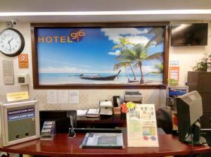 an office cubicle with a hotel sign on the wall at SRP Hotel Sdn Bhd in Batu Caves