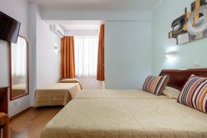 Postel nebo postele na pokoji v ubytování Hotel Anjos