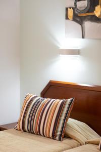 Postel nebo postele na pokoji v ubytování Hotel Anjos
