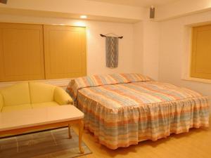 Postel nebo postele na pokoji v ubytování Hotel Fine Olive Sakai