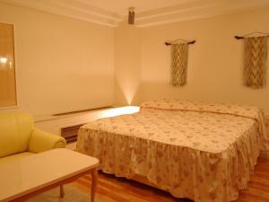 Postel nebo postele na pokoji v ubytování Hotel Fine Olive Sakai