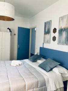 Кровать или кровати в номере RESIDENZA 8