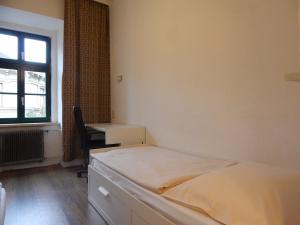 Postel nebo postele na pokoji v ubytování DORMitory + 3 fotografie