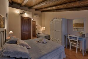 Postel nebo postele na pokoji v ubytování B&B Le Oasi