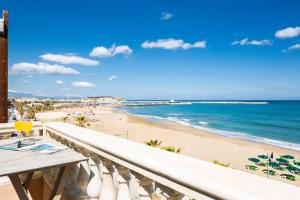 a balcony with a view of a beach and the ocean at Birais Beach Studios in Rethymno