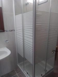 a bathroom with a shower and a sink at Casas da Saibreira - nº9 in Elvas