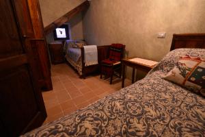 Postel nebo postele na pokoji v ubytování Robur Marsorum Albergo Diffuso