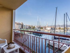 a balcony with a view of a marina with boats at Apartment Bahia II by Interhome in Empuriabrava