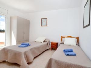 Posteľ alebo postele v izbe v ubytovaní Villa Villa Cala Llenya by Interhome