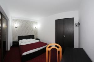 Postel nebo postele na pokoji v ubytování Hotel Rebis