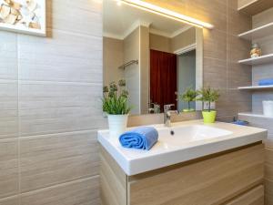 a bathroom with a sink and a mirror at Holiday Home Sant Mori by Interhome in Empuriabrava