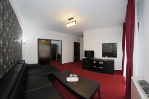 TV a/nebo společenská místnost v ubytování Hotel Rebis