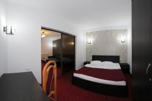 Postel nebo postele na pokoji v ubytování Hotel Rebis