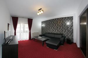 TV a/nebo společenská místnost v ubytování Hotel Rebis