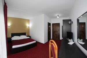 Postel nebo postele na pokoji v ubytování Hotel Rebis