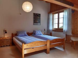 Ein Bett oder Betten in einem Zimmer der Unterkunft Apartment Stöckli by Interhome