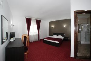 Postel nebo postele na pokoji v ubytování Hotel Rebis