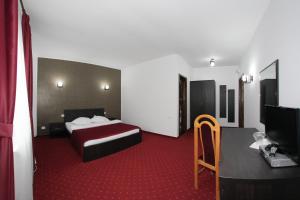 Postel nebo postele na pokoji v ubytování Hotel Rebis