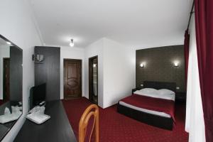 Postel nebo postele na pokoji v ubytování Hotel Rebis