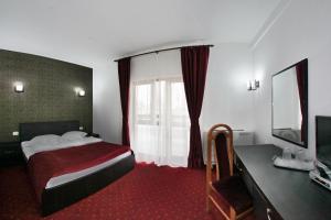 Postel nebo postele na pokoji v ubytování Hotel Rebis