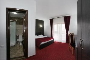 Postel nebo postele na pokoji v ubytování Hotel Rebis
