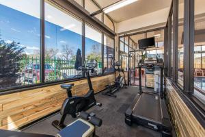 a gym with two treadmills and two ellipticals at Quality Inn South in Colorado Springs
