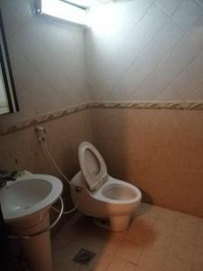a bathroom with a toilet and a sink at ضيافه السعاتى 1 للعوائل فقط in Al Khobar