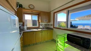 a kitchen with a sink and a microwave at Casa Blanca - Sunset Villa in Valle Gran Rey