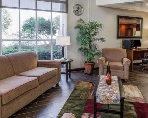 a living room with a couch and a table at Comfort Inn & Suites Lakeland North I-4 in Lakeland