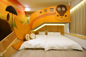 Katil atau katil-katil dalam bilik di Tainan Lio Kid Family Homestay
