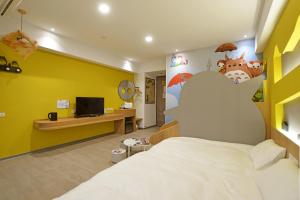 Katil atau katil-katil dalam bilik di Tainan Lio Kid Family Homestay