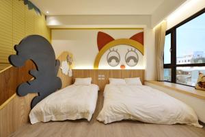 Katil atau katil-katil dalam bilik di Tainan Lio Kid Family Homestay
