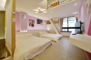 Katil atau katil-katil dalam bilik di Tainan Lio Kid Family Homestay