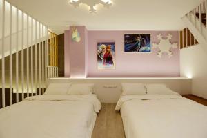 Katil atau katil-katil dalam bilik di Tainan Lio Kid Family Homestay