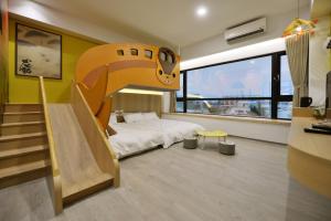 Katil atau katil-katil dalam bilik di Tainan Lio Kid Family Homestay