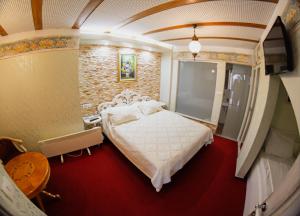 Letto o letti in una camera di Hotel Lula