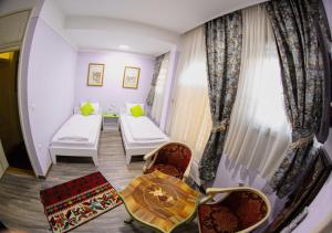 Letto o letti in una camera di Hotel Lula
