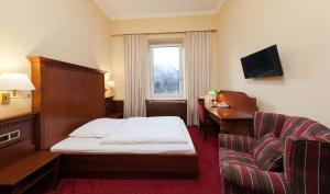 Postel nebo postele na pokoji v ubytování Hotel Marienhof