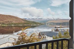 a view of a body of water from a balcony at Garrison Apartments in Fort William