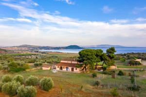 an aerial view of a house and a lake at Podere Caprarecce Trilocale 6 in Talamone