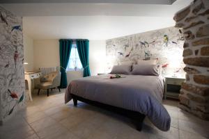 a bedroom with a large bed with blue curtains at Le Clos Saint Lubin in Nainville-les-Roches +75 photos