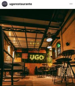 a restaurant with tables and chairs in a room at Presidential Suite na orla da Praia da Costa in Vila Velha