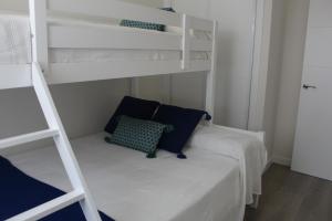 Ένα ή περισσότερα κρεβάτια σε δωμάτιο στο Apartamento en la playa Málaga