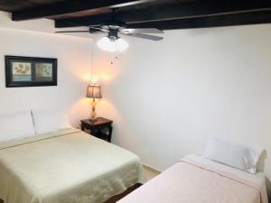 Кровать или кровати в номере Hotel Carretas by Rotamundos